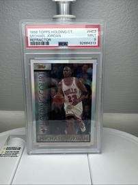 Holding Topps (PSA)